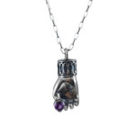 sterling silver hand necklace holding amethyst